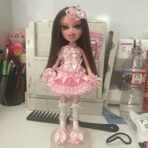 Elegant Pink Fashion Doll with Bow Accents